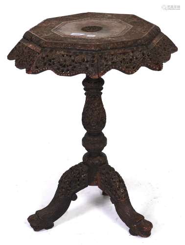 An Anglo-Indian carved and pierced black wood tripod table, ...
