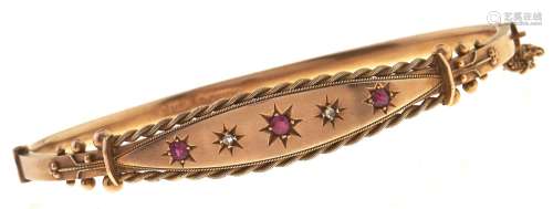 An Edwardian ruby and diamond bangle, gipsy set in 9ct gold,...