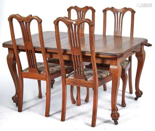 An oak single leaf extending dining table, c1930's, the roun...