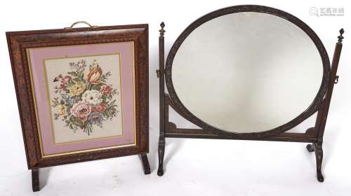 A Victorian carved mahogany dressing mirror with oval plate,...