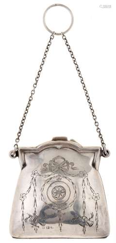 A silver bag shaped purse, each side engraved with circular ...