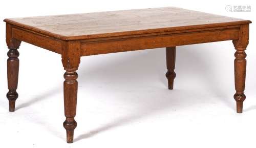 An oak kitchen table with pine top, early 20th c, on turned ...
