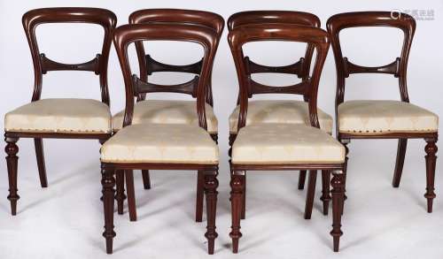 A set of six Victorian mahogany dining chairs, on fluted leg...