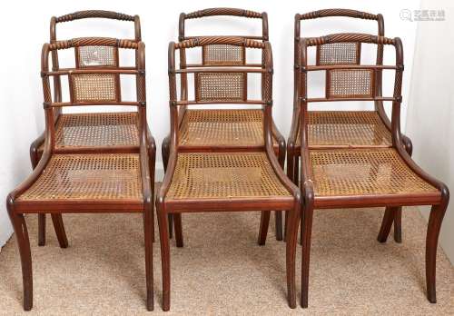 A set of six George IV caned mahogany and line inlaid dining...