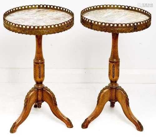 A pair of French giltmetal mounted limed wood tripod tables,...