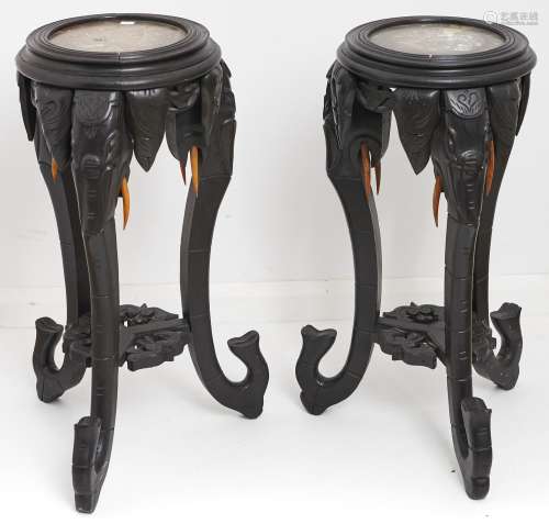 A pair of oriental marble topped ebonised jardinere stands, ...