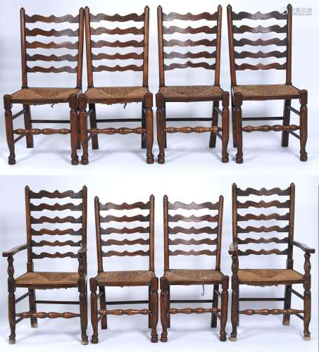 A set of eight ash ladder back dining chairs with graduated ...