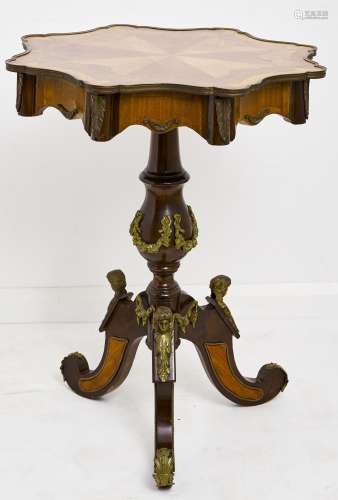 A tulipwood, walnut and stained wood gueridon, 20th c, in Na...