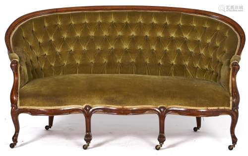 A French walnut sofa, late 19th c, on brass castors upholste...