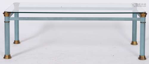 A modern glass topped coffee table, on coated metal base, 39...