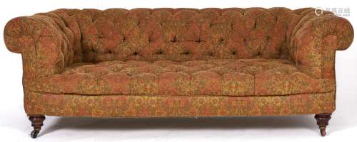 A Victorian Chesterfield sofa, with walnut feet and pottery ...