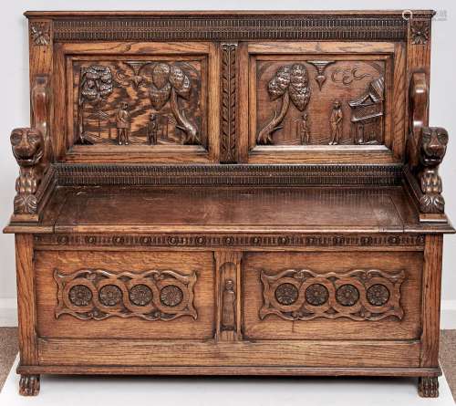 A reproduction oak monk's bench, c1950, the twin panelled ba...