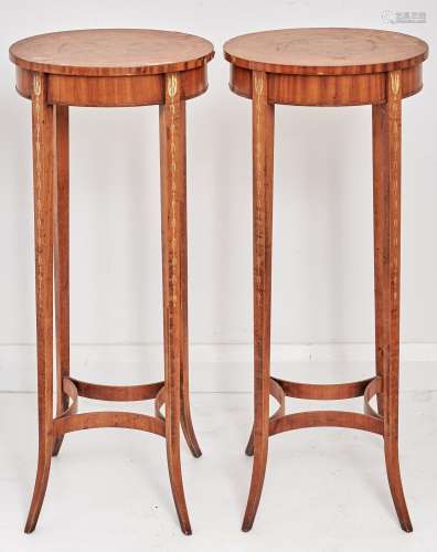 A pair of oval painted satinwood occasional tables, second q...