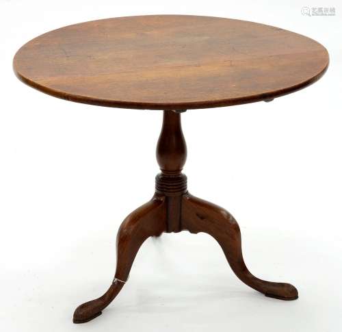 A George III oak tripod table, early 19th c, the round top o...