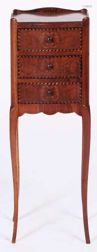 A French kingwood, mahogany and marquetry table en chiffonni...