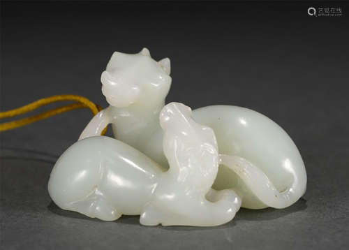 A Carved White Jade Animal Pendant