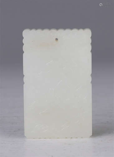 A Carved White Jade Figural Pendant