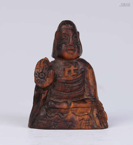 A Carved Huali Wood Buddha