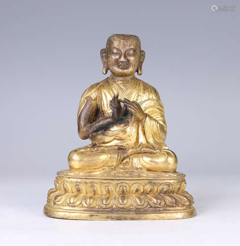 A Gilt Bronze Seated Figure of Guru