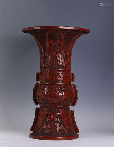 A Carved Cinnabar Lacquer Taotie Beaker Vase Gu