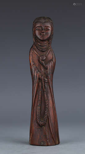 A Carved Wood Standing Figure