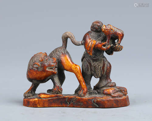 A Carved Organic Material Figure and Animals