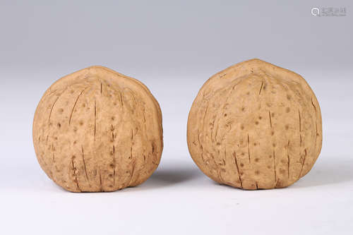 A Pair of Yixing Glazed Decorating Walnuts