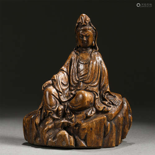 A Carved Chenxiang Wood Seated Figure of Guanyin