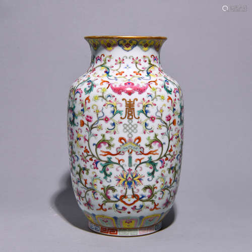 A POWDER COLORED FLOWER PATTERNED BOTTLE