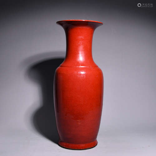 A RED GLAZED BOTTLE