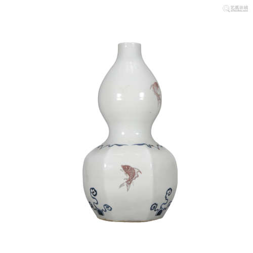 A white glazed gourd-shaped vase