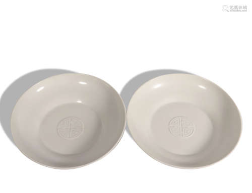 A pair of white glazed dish