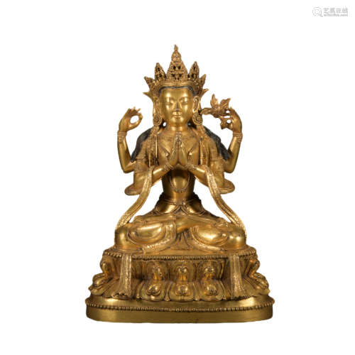 A gilt-bronze statue of Four arm Avalokitesvara