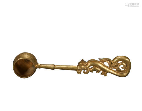 A gilt-bronze spoon