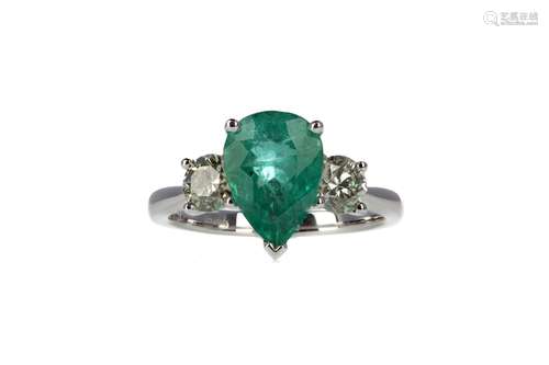 AN EMERALD AND DIAMOND THREE STONE RING