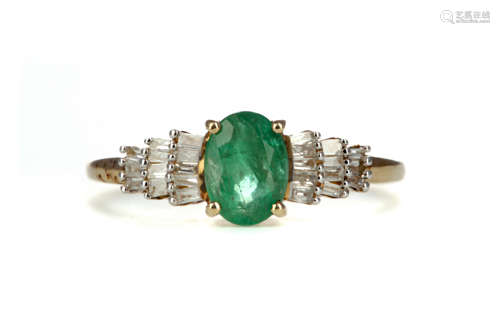 AN EMERALD AND DIAMOND RING