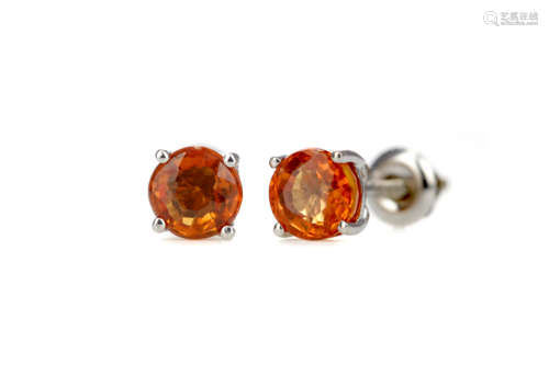 A PAIR OF TREATED ORANGE SAPPHIRE STUD EARRINGS