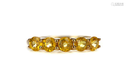 A TREATED YELLOW SAPPHIRE RING