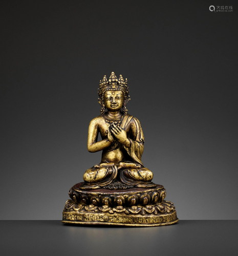 A GILT BRONZE FIGURE OF A BUDDHA, DATED 1709