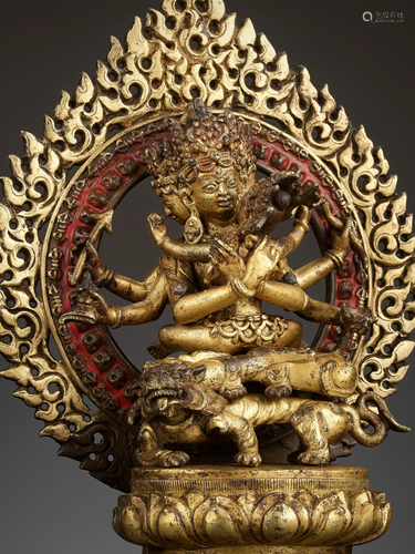 A GILT-BRONZE FIGURE OF GUHYASAMAJA IN A SHRINE