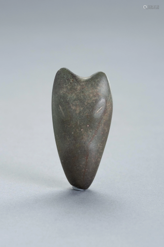 AN ARCHAIC NEPHRITE ZOOMORPHIC CARVING