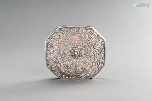 A RETICULATED SILVER LID WITH PHOENIXES