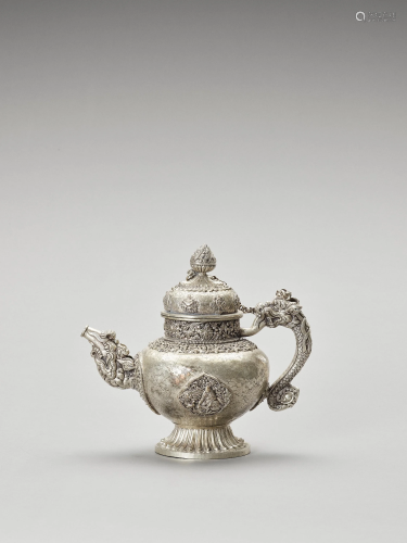 AN IMPRESSIVE SILVER-PLATED METAL TEAPOT