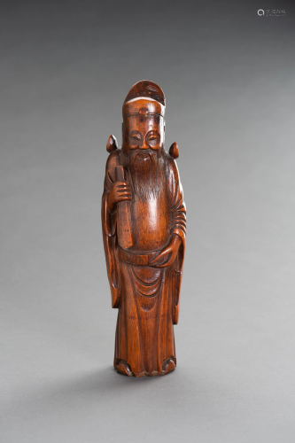 A CARVED BAMBOO FIGURE OF AN IMMORTAL