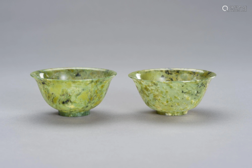 A MOTTLED PAIR OF SPINACH GREEN JADE BOWLS