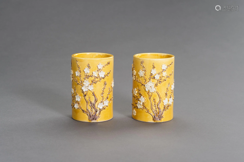 TWO YELLOW GLAZED BRUSHPOTS WITH APPLIED DECOR.