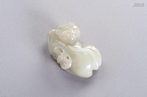 A CELADON JADE 'CAT AND BUTTERFLY' PENDAN