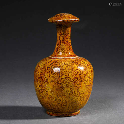 A BROWN GLAZED POTTERY JAR