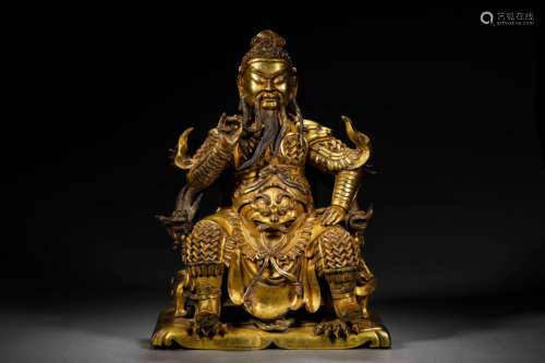 A GILT BRONZE WORRIOR BUDDHA STATUE