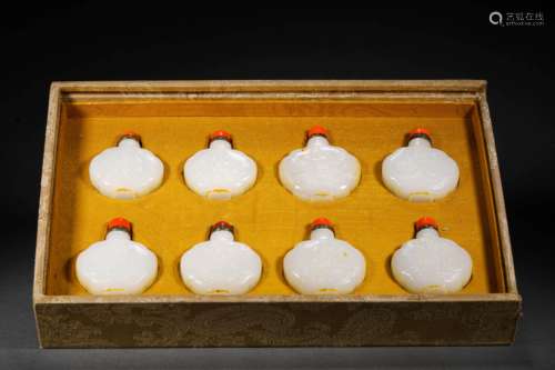 A SET OF 8 WHITE HETIAN JADE SNUFF BOTTLES